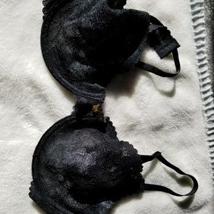 Black lace bra with scalloped edge.